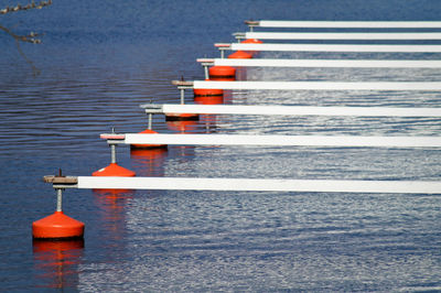 Side view of jetty in rows at rippled water