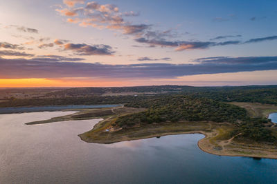 Drone panoramic aerial view of minutos dam in arraiolos alentejo at sunset, portugal