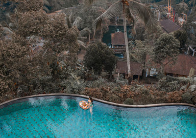 High angle view of woman swimming in pool