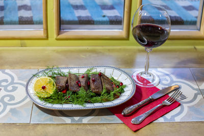 High angle view of wine glass on table