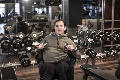 Man on wheelchair training in gym