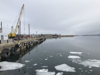 Pier over lake against sky