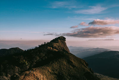 Scenic view of mountains against sky at sunset