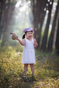 Full length of girl playing at park