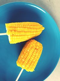 High angle view of yellow slices in bowl on table