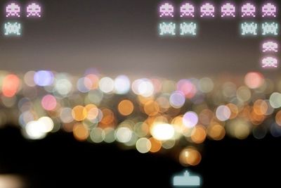 Defocused image of illuminated lights at night