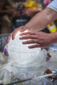 Close-up of woman holding ice