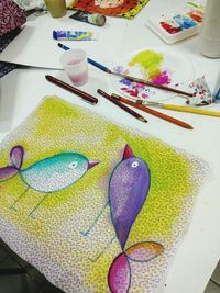 High angle view of multi colored fish on table