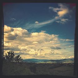 Scenic view of landscape against cloudy sky