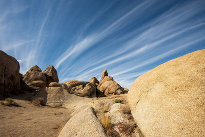 Panoramic view of rocks on beach against sky