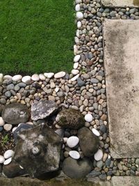 High angle view of stones by stone wall