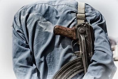 Close-up of man holding umbrella