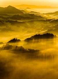 Scenic view of landscape against dramatic sky