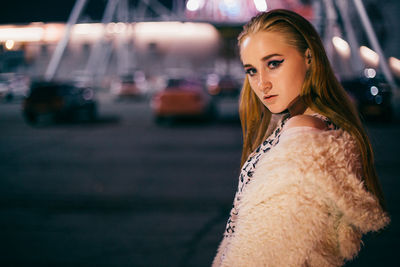 Portrait of beautiful young woman in city