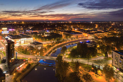 High angle view of illuminated buildings in city at night