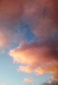 Low angle view of cloudy sky at sunset