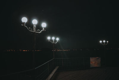 Illuminated street light at night