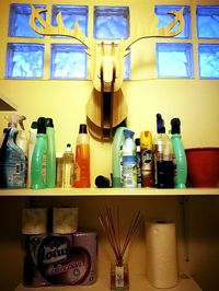 Various bottles on shelf in kitchen