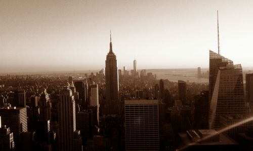 Modern buildings in city against clear sky