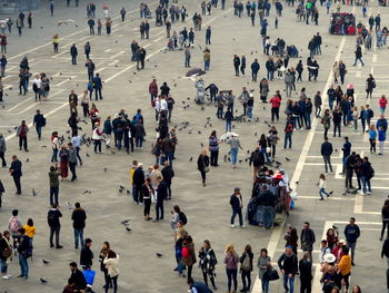 High angle view of people walking on road