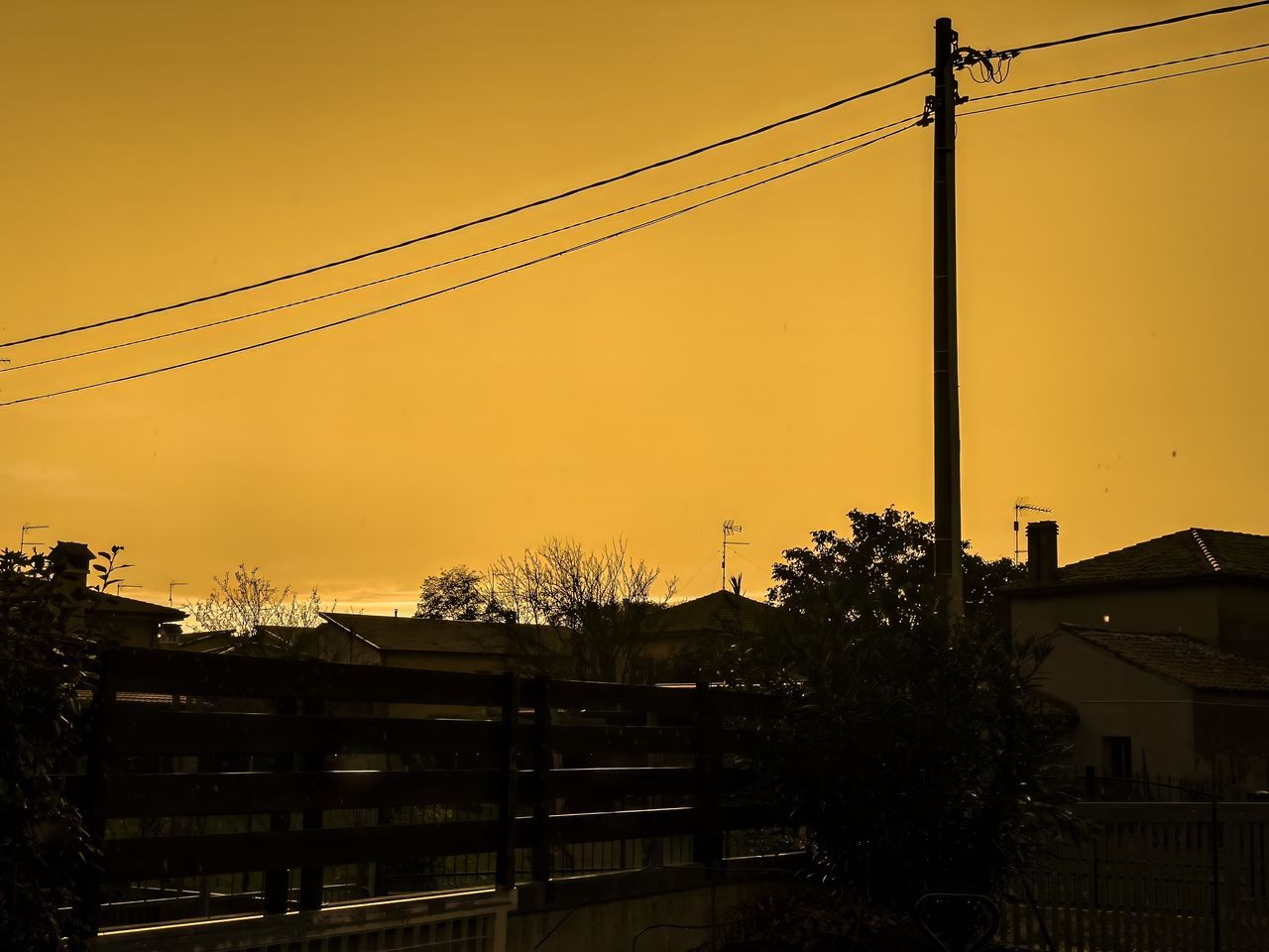 sky, evening, sunset, cable, architecture, built structure, dusk, nature, electricity, silhouette, technology, building exterior, no people, power line, tree, electricity pylon, sunlight, city, urban area, outdoors, plant, power supply, light, building, power generation