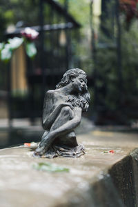 Close-up of angel statue in park