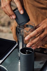 Close-up of man holding coffee cup