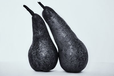 Close-up of bananas against white background