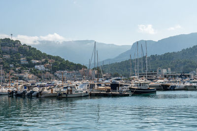 Boats in sea against sky