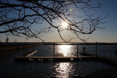 Scenic view of river against sky at sunset