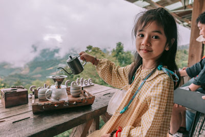 Young woman using phone