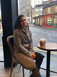 Portrait of woman sitting on chair