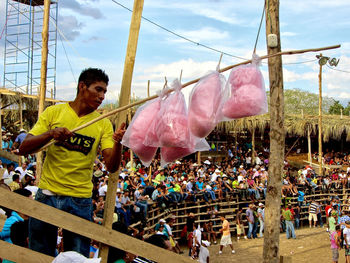 Panoramic view of man looking at camera