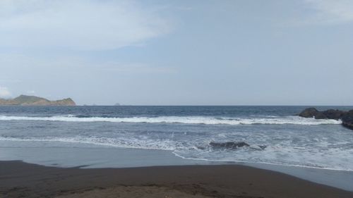 Scenic view of beach against sky