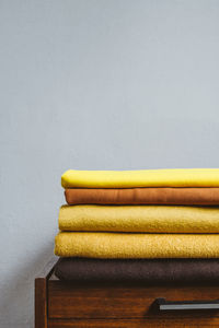 Color of the year 2021. illuminating and ultimate gray. stack of yellow cloth 
