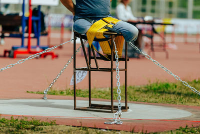 Low section of man exercising on field