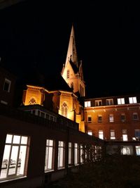 Low angle view of illuminated building at night