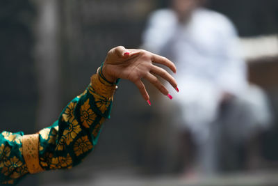 Close-up of hand holding bird