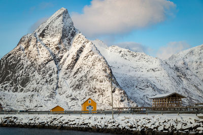 Yellow houses with snowcapped mountain