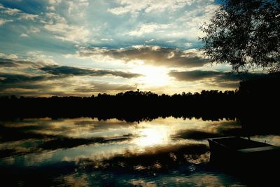 Scenic view of river at sunset