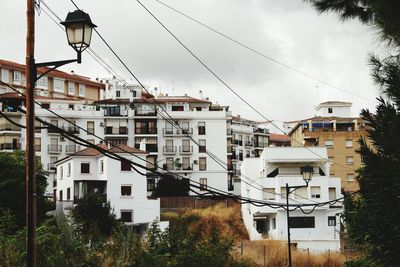 Houses against sky in city