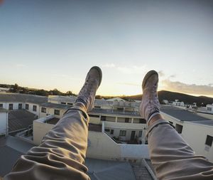 Low section of man relaxing outdoors