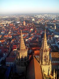 High angle view of city buildings against sky