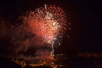 Firework display at night