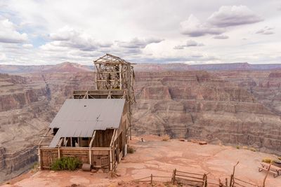 Built structure on landscape against sky