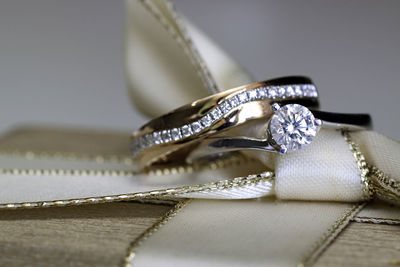 Close-up of wedding rings on table