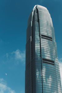 Low angle view of modern building against blue sky