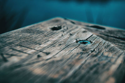 Close-up of wooden plank on table