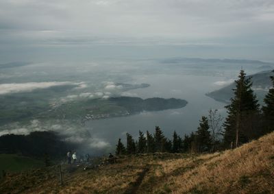 Scenic view of mountains against cloudy sky