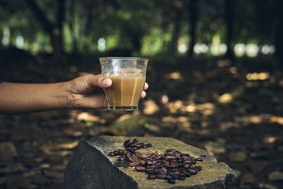 Close-up of hand holding drink